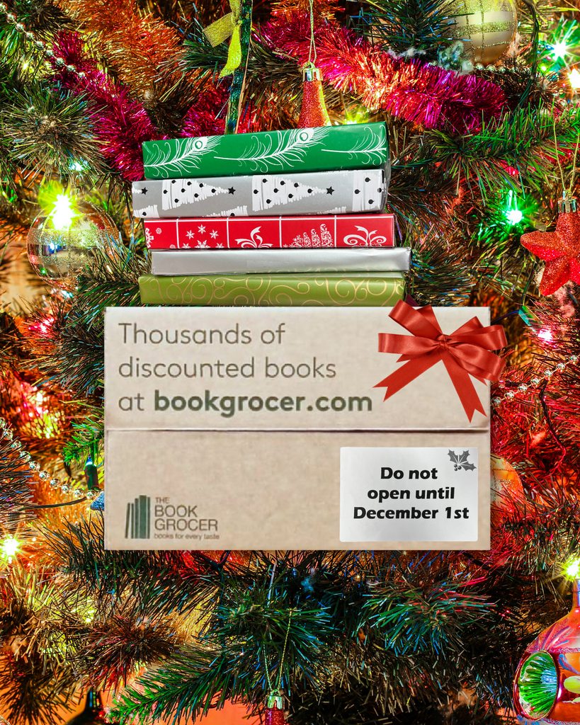 Image shows Book Grocer's Chapter Book Box with a stack of wrapped books on top against a Christmassy background of lights and tinsel. Sticker on Book Box says "Do not open until December 1st".