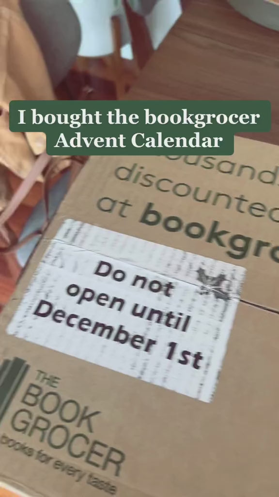 Video shows a person unboxing an Advent Book Box. The Book Box is opened and shows the contents - 24 individually wrapped books. Text on video says "How am I supposed to wait until December to start opening them??"